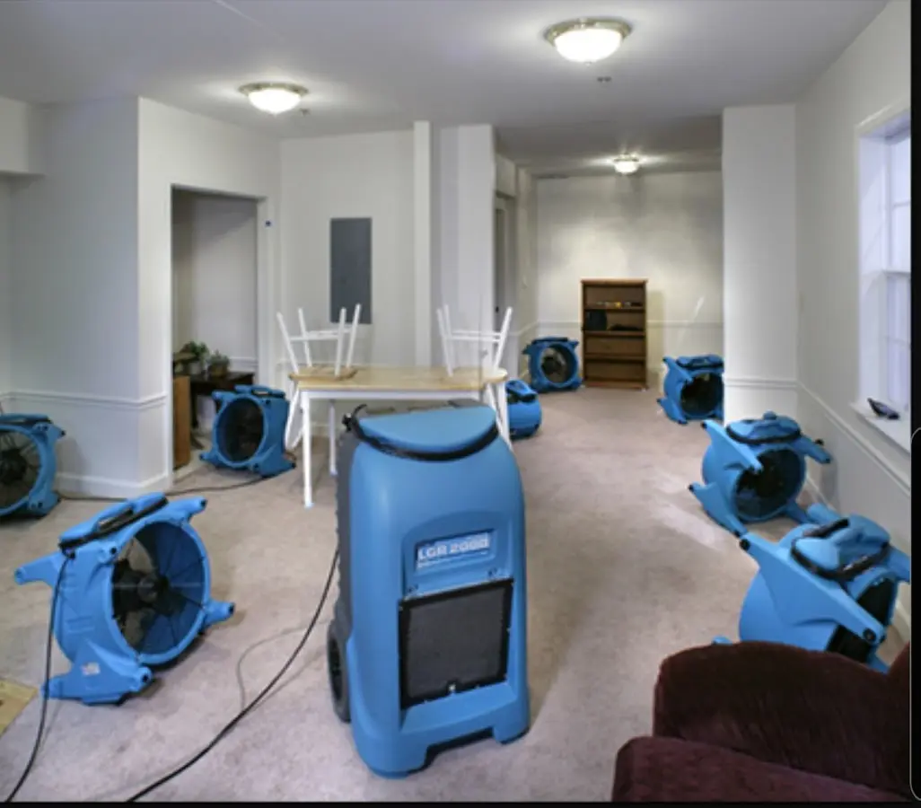 Air movers and dehumidifier setup for Water Damage Restoration in Carthage